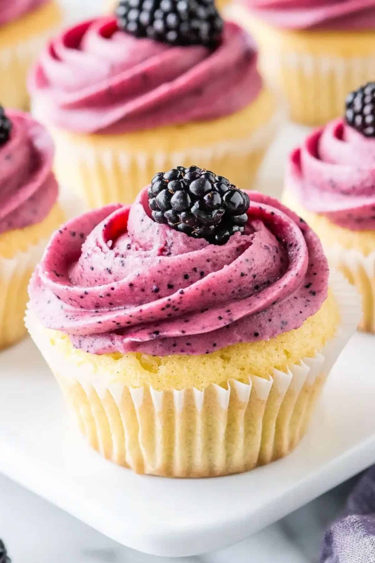 Light, Zesty, and Delicious: Lemon Poppy Seed Cupcakes with Blackberry Frosting